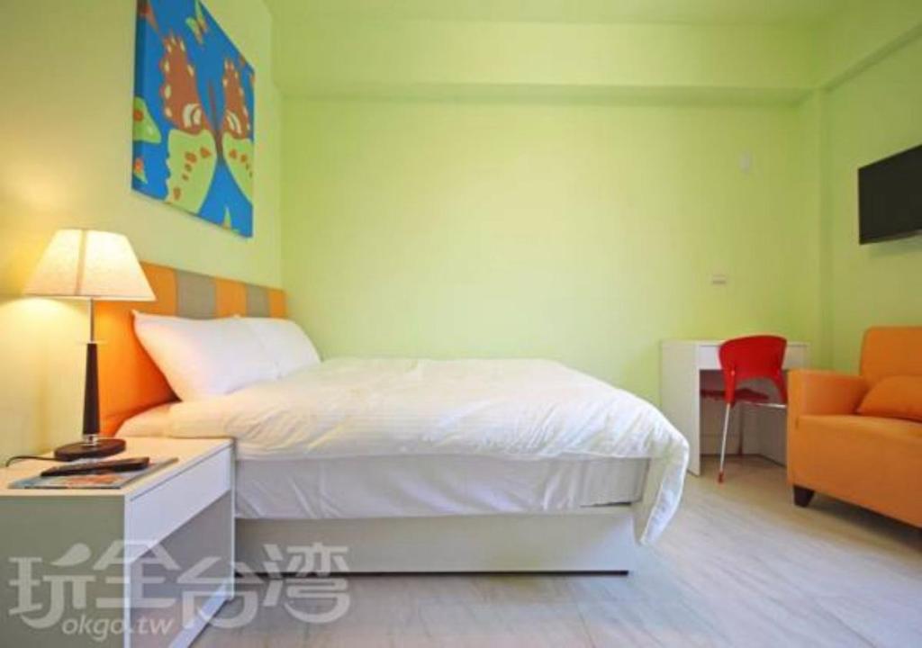 Postel nebo postele na pokoji v ubytování Kinmen Line In Bed and Breakfast