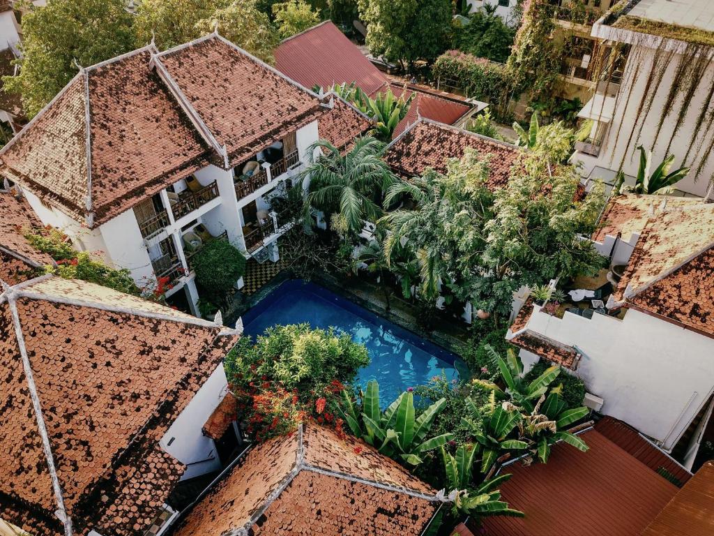 an aerial view of a building with a swimming pool at Rambutan Resort – Siem Reap in Siem Reap