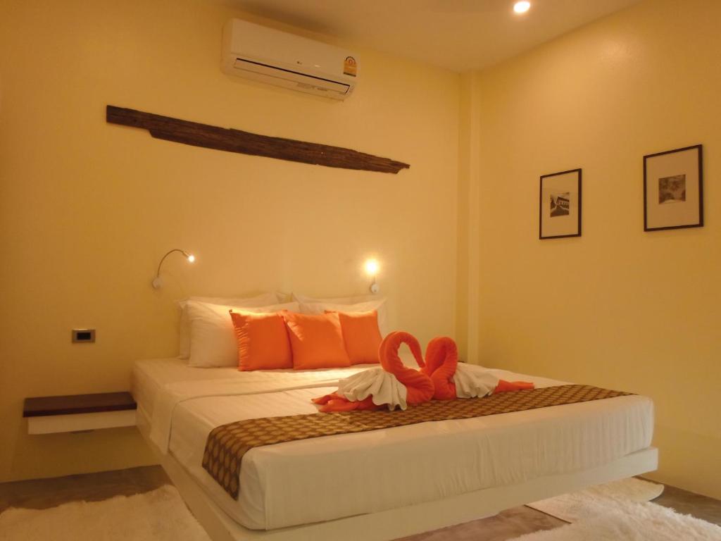 Кровать или кровати в номере Chuan Chom Villas