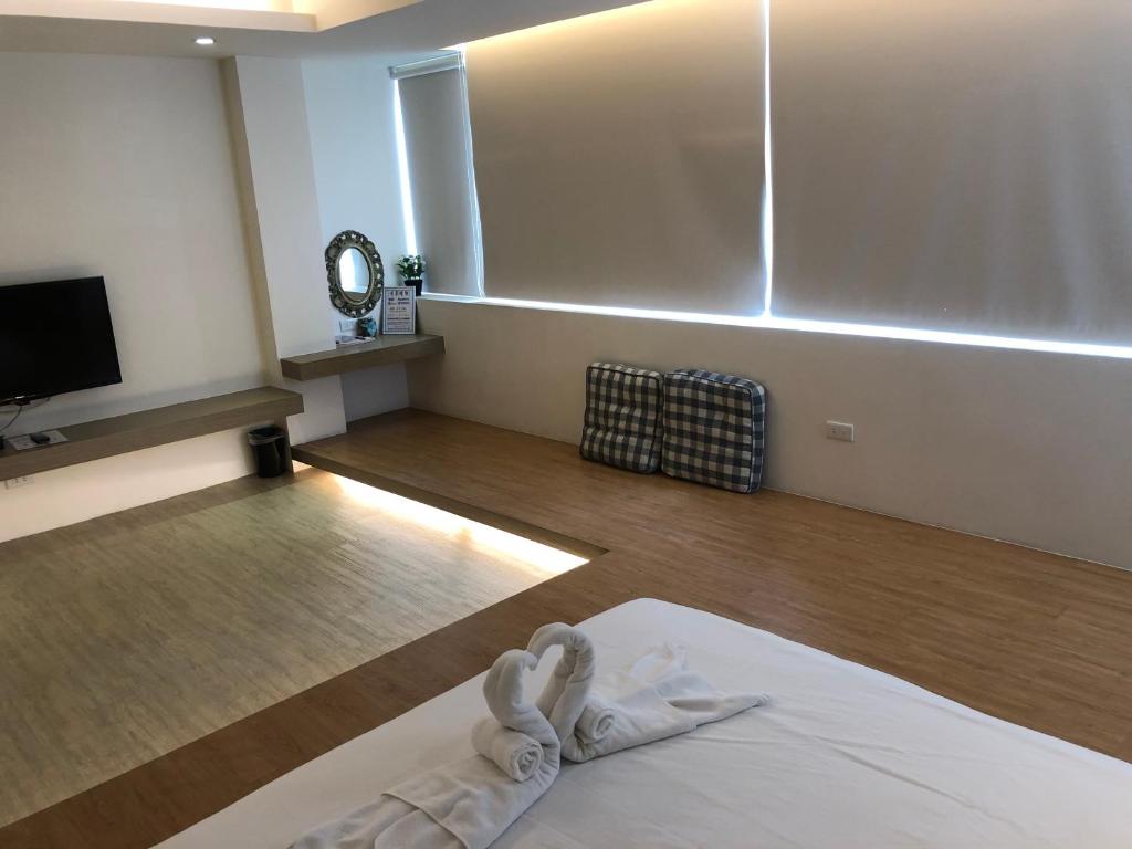 Postel nebo postele na pokoji v ubytování 幸福圓點新北市民宿220號