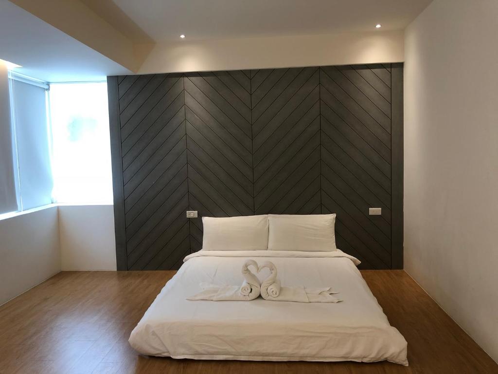 Postel nebo postele na pokoji v ubytování 幸福圓點新北市民宿220號