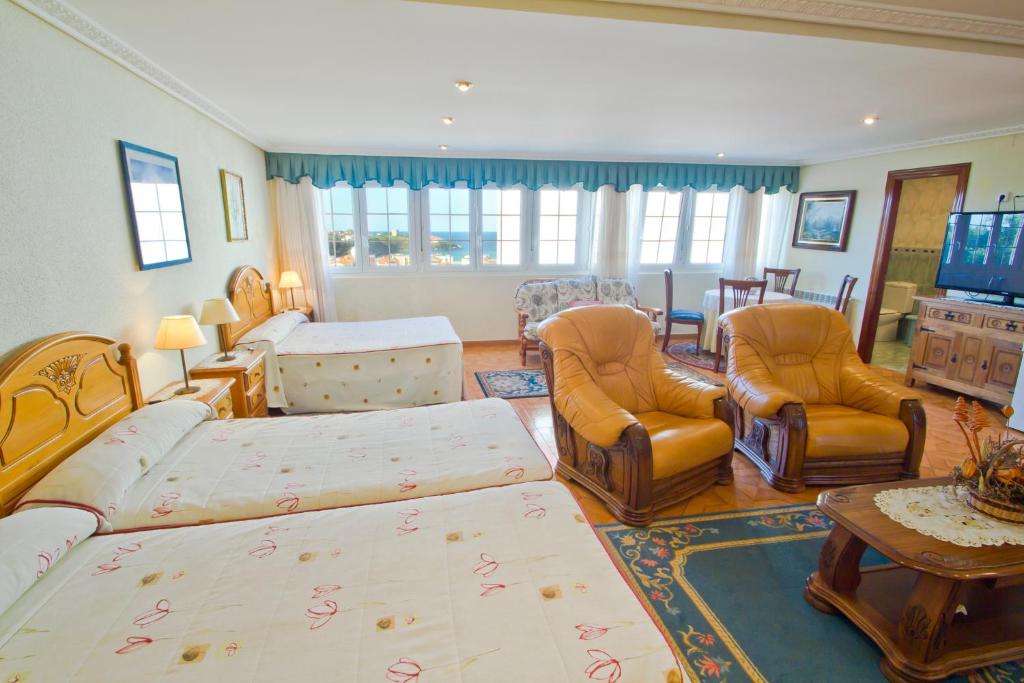 A bed or beds in a room at Hospedaje Roiz