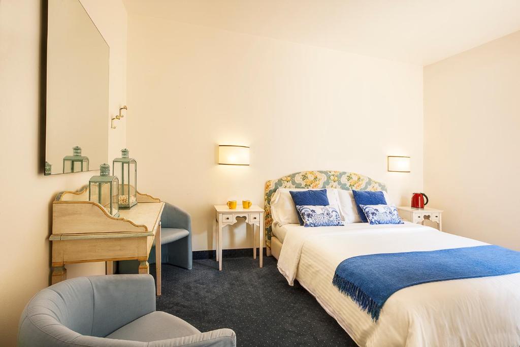 Postel nebo postele na pokoji v ubytování Albergo Al Moretto