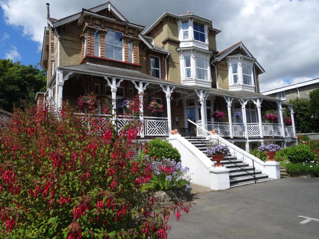 a large house with flowers in front of it at The Belmont in Shanklin