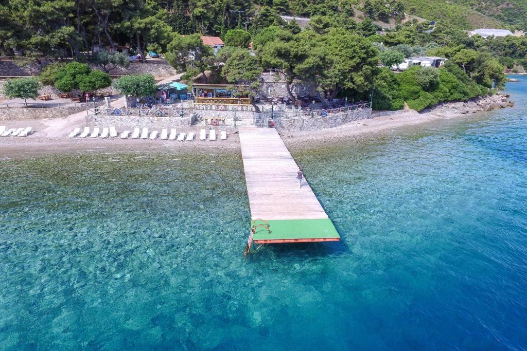 an aerial view of a dock in the water at Tsolis Village in Lambírion