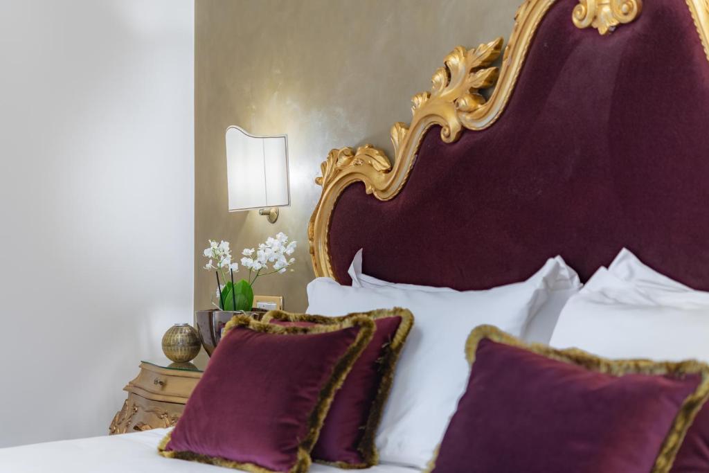 Postel nebo postele na pokoji v ubytování Hotel Concordia