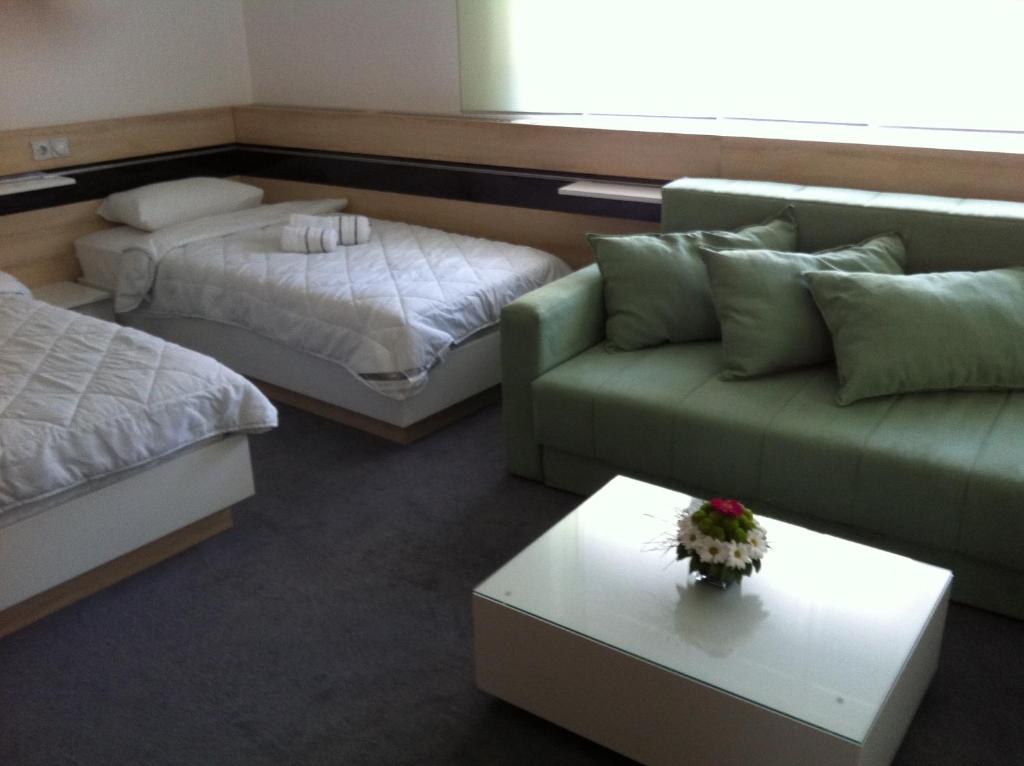 Voodi või voodid majutusasutuse Garni Hotel Consul toas