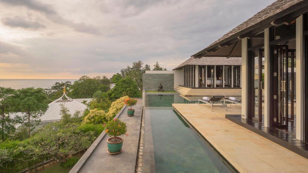 a house with a pool and a view of the ocean at Villa Princess Stephanie in Kata Beach