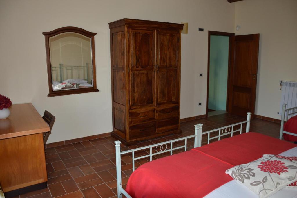 A bed or beds in a room at Casa vacanza Borgo Parrini