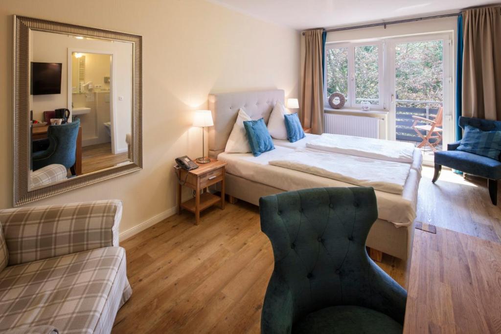 Postel nebo postele na pokoji v ubytování Das Frühstückshotel Sankt Peter-Ording
