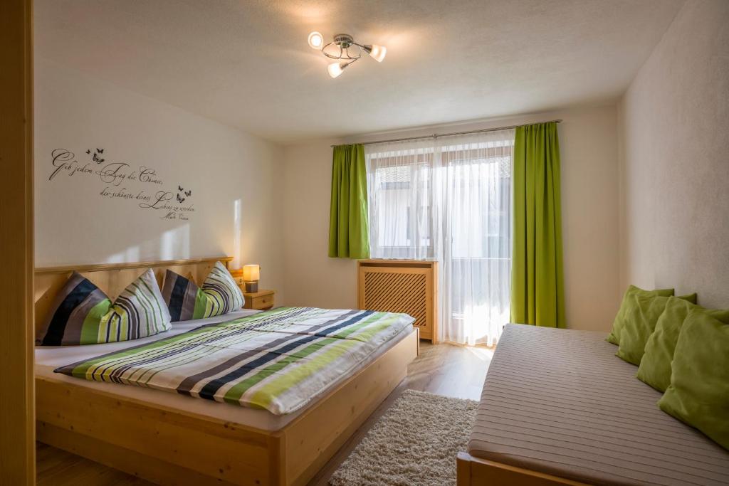 Postel nebo postele na pokoji v ubytování Berghof Geisler