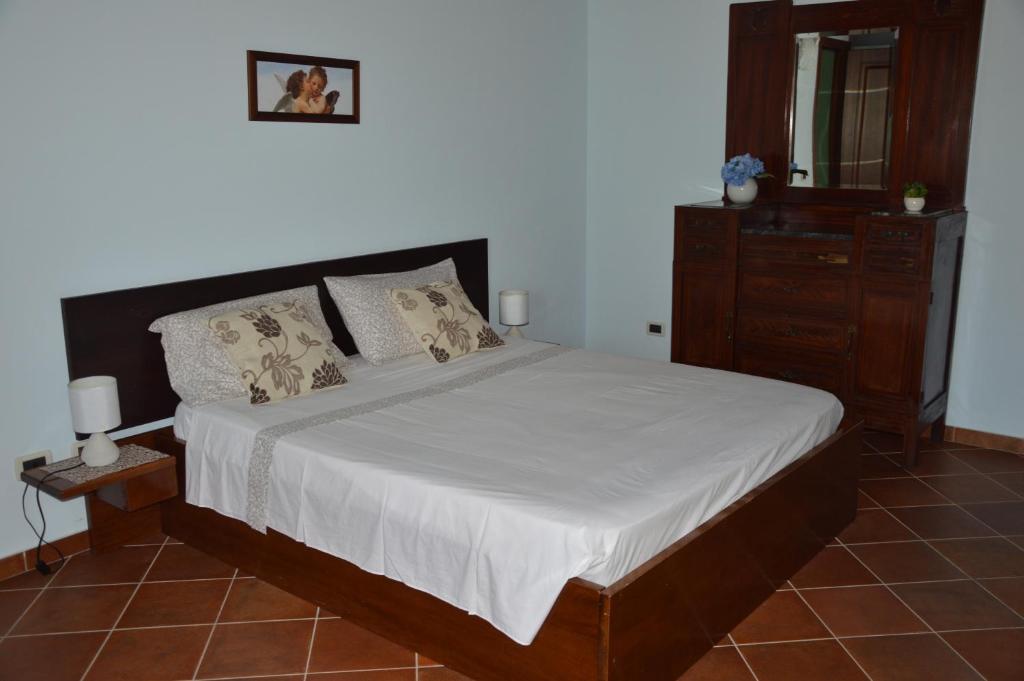 A bed or beds in a room at Casa vacanza Borgo Parrini