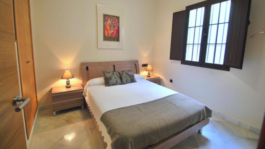 Posteľ alebo postele v izbe v ubytovaní Living-Sevilla Apartments San Lorenzo
