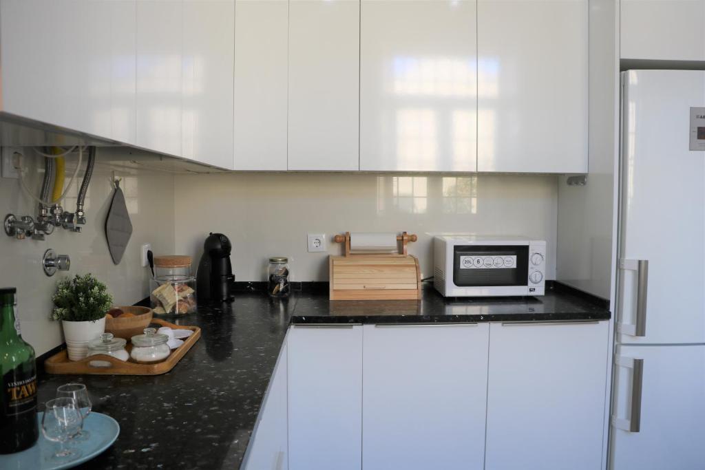 Kuchyň nebo kuchyňský kout v ubytování Jardim das Amoreiras Central Apartment