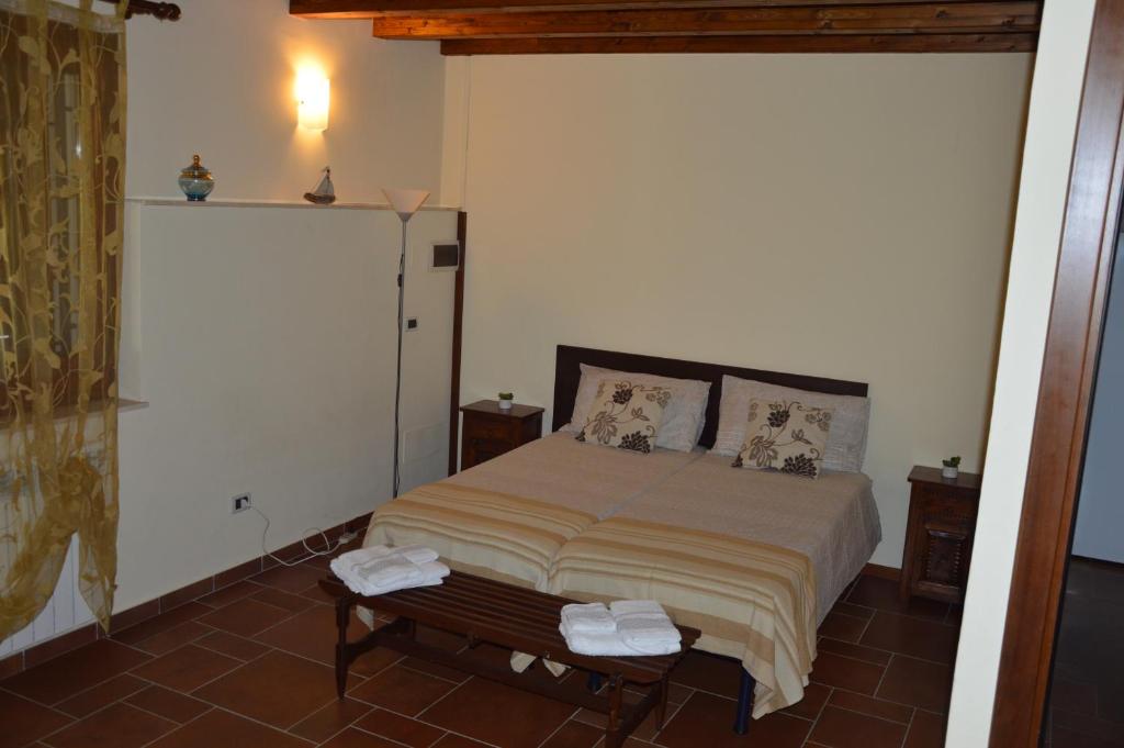A bed or beds in a room at Casa vacanza Borgo Parrini