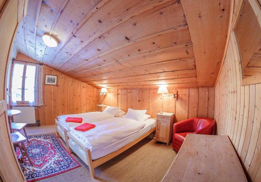 Postel nebo postele na pokoji v ubytování Guest House du Grand Paradis - On Piste