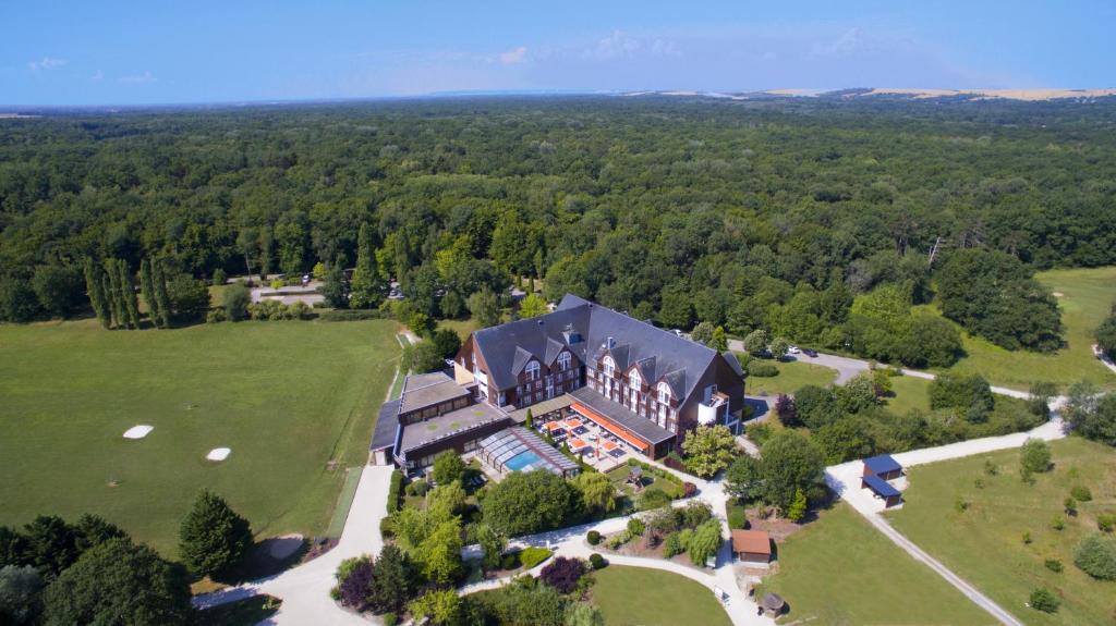 an aerial view of a large house in a field at Domaine de la Forêt d'Orient, Logis Hôtel, Restaurant, Spa et Golf in Rouilly-Sacey