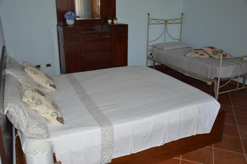A bed or beds in a room at Casa vacanza Borgo Parrini