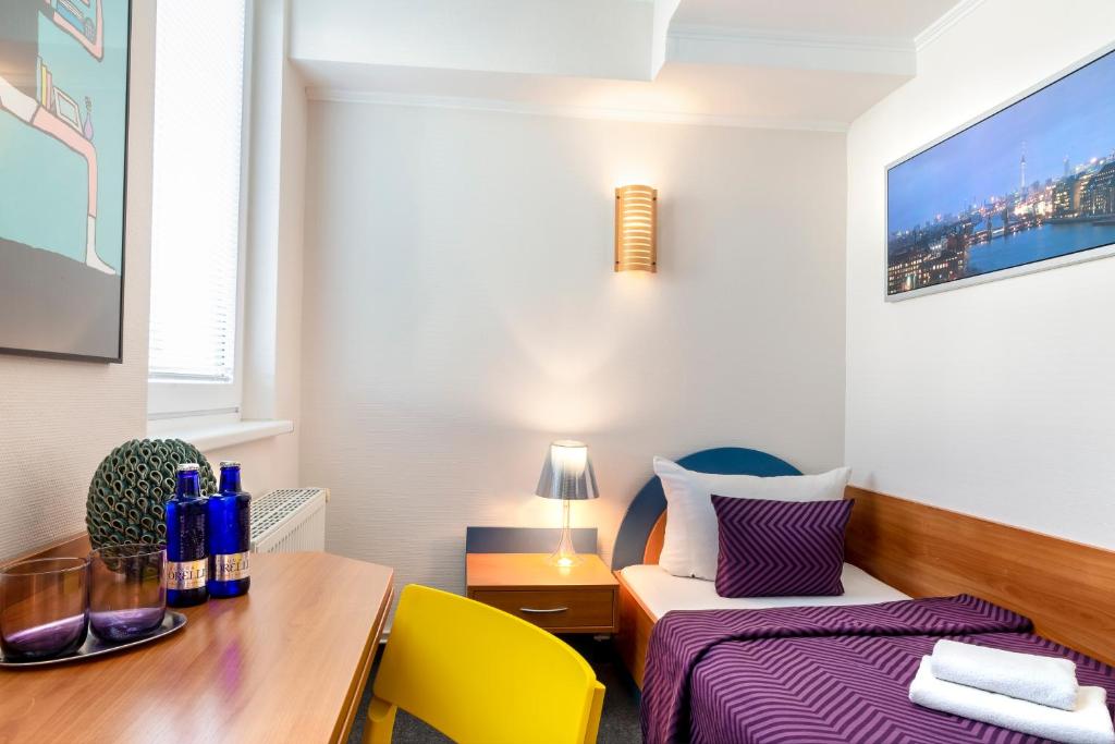 Postel nebo postele na pokoji v ubytování Hotel Ambiente Berlin City