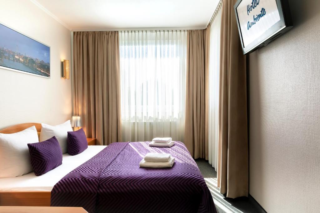 Postel nebo postele na pokoji v ubytování Hotel Ambiente Berlin City