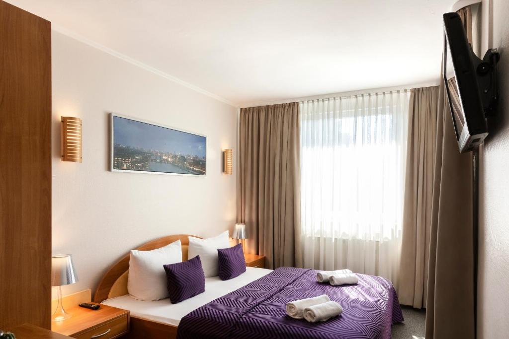 Postel nebo postele na pokoji v ubytování Hotel Ambiente Berlin City