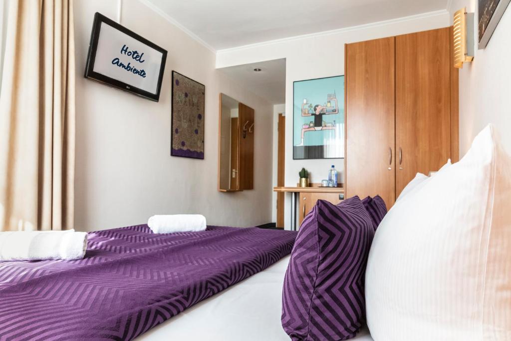 Postel nebo postele na pokoji v ubytování Hotel Ambiente Berlin City