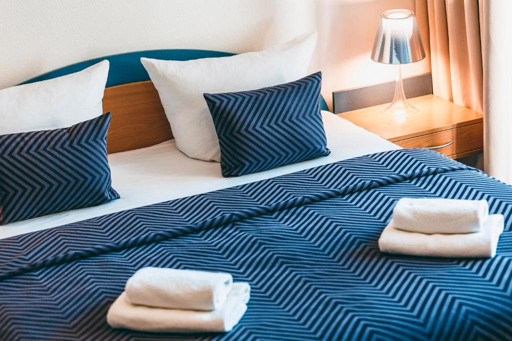 Postel nebo postele na pokoji v ubytování Hotel Ambiente Berlin City