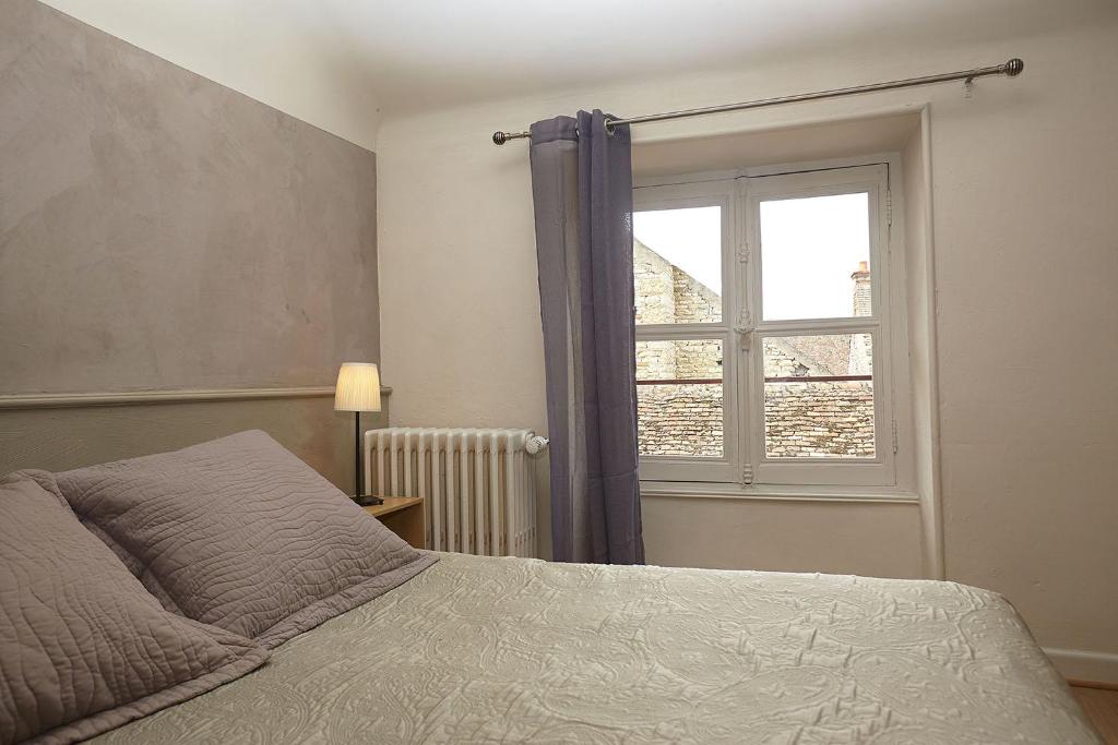 Postel nebo postele na pokoji v ubytování Hôtel Le Foch