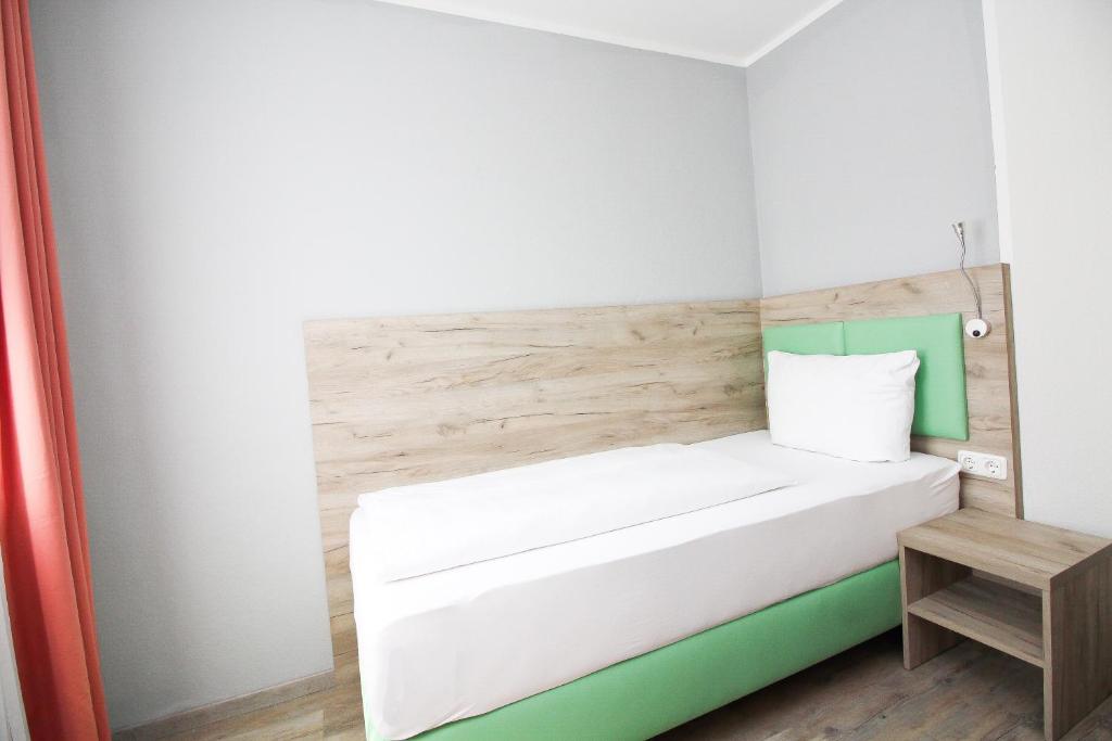 Postel nebo postele na pokoji v ubytování Hotel Pension Köberl