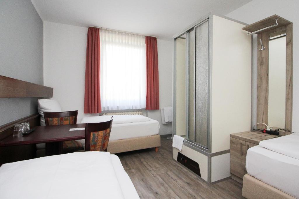 Postel nebo postele na pokoji v ubytování Hotel Pension Köberl