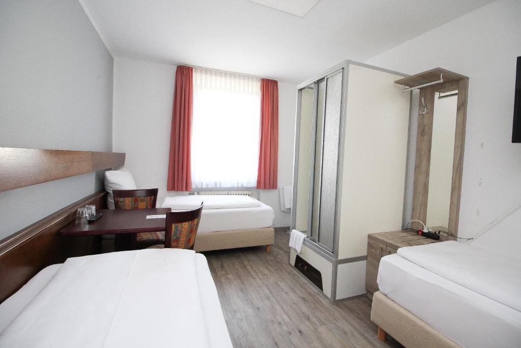 Postel nebo postele na pokoji v ubytování Hotel Pension Köberl
