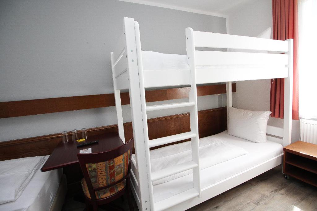 Postel nebo postele na pokoji v ubytování Hotel Pension Köberl