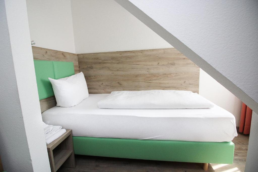 Postel nebo postele na pokoji v ubytování Hotel Pension Köberl