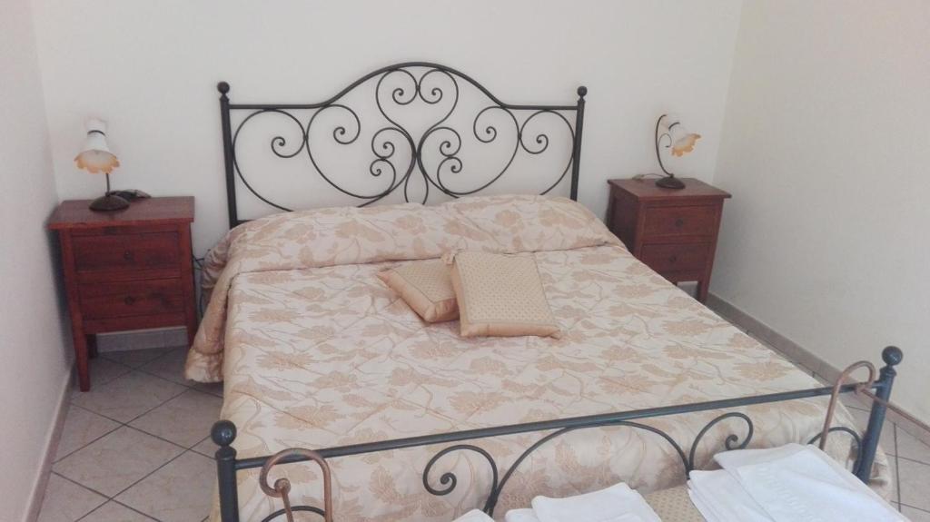 Postel nebo postele na pokoji v ubytování Agriturismo La Palombara