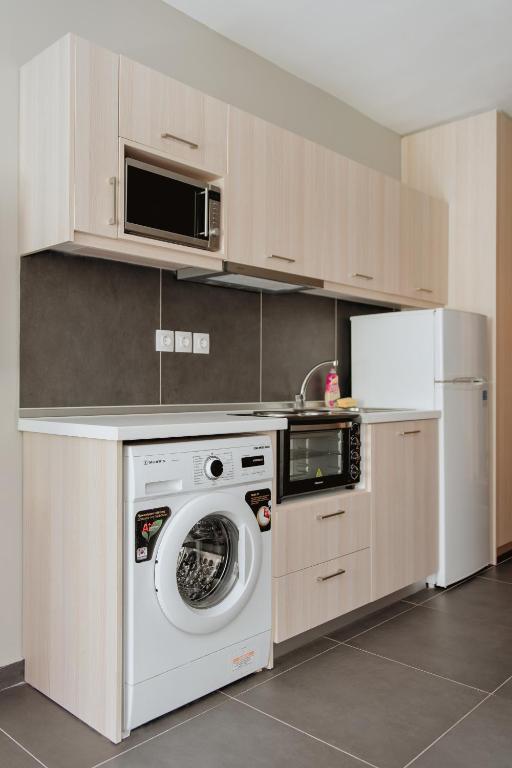 A kitchen or kitchenette at Stylish Suites, The Luxury Suites