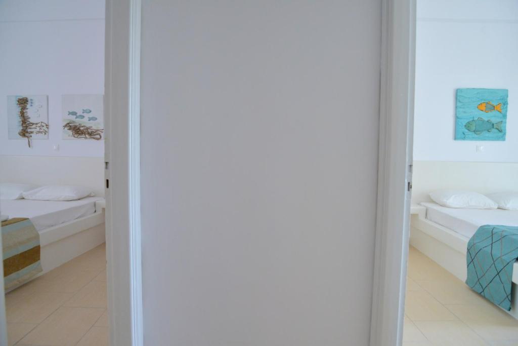 Postel nebo postele na pokoji v ubytování Corali Hotel
