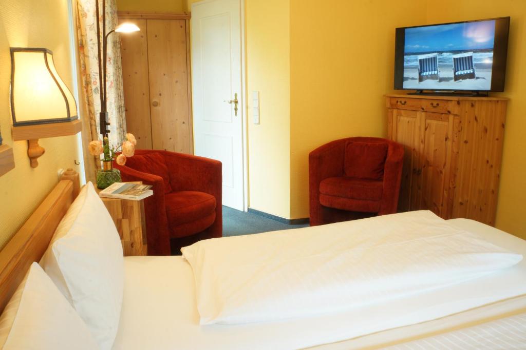 Postel nebo postele na pokoji v ubytování Hotel am Südwäldchen