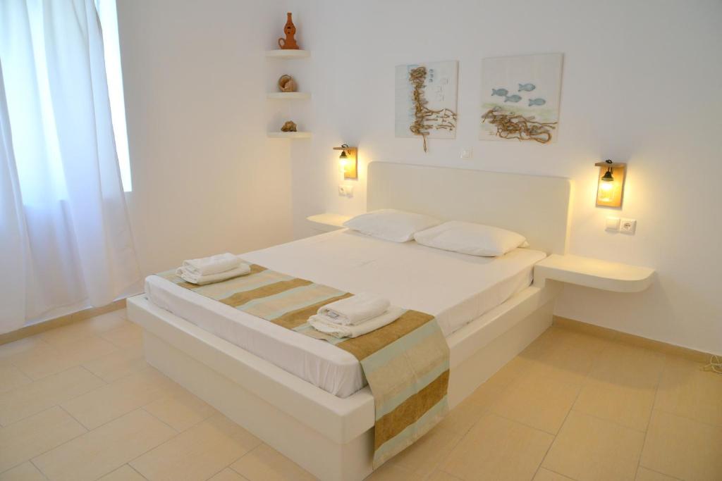 Postel nebo postele na pokoji v ubytování Corali Hotel