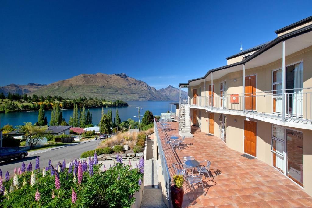 a balcony of a building with a view of a lake at Alexis Motel & Apartments in Queenstown