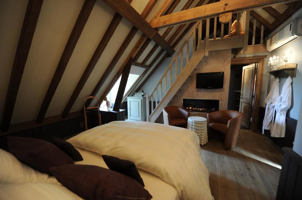 Postel nebo postele na pokoji v ubytování B&B De Rentmeesterhoeve
