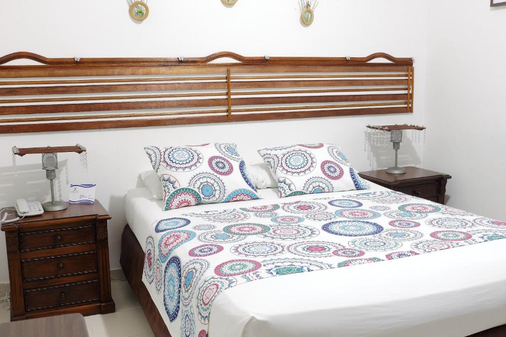 Postel nebo postele na pokoji v ubytování Hotel Zandu