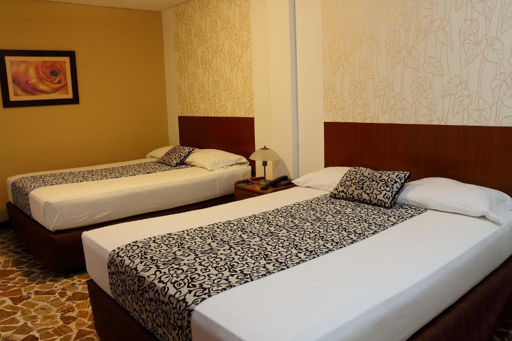 Postel nebo postele na pokoji v ubytování Hotel Zandu