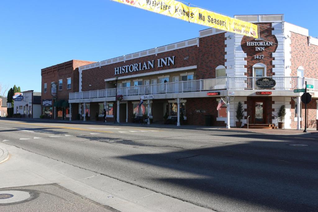 an empty street in front of a brick building at Historian Inn in Gardnerville