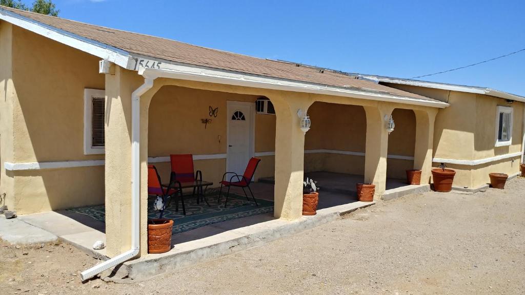 a porch of a house with chairs on it at Dolan Springs, Grand Canyon Skywalk in Dolan Springs