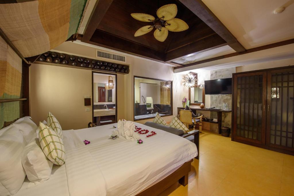 Postel nebo postele na pokoji v ubytování Samui Jasmine Resort - SHA Plus