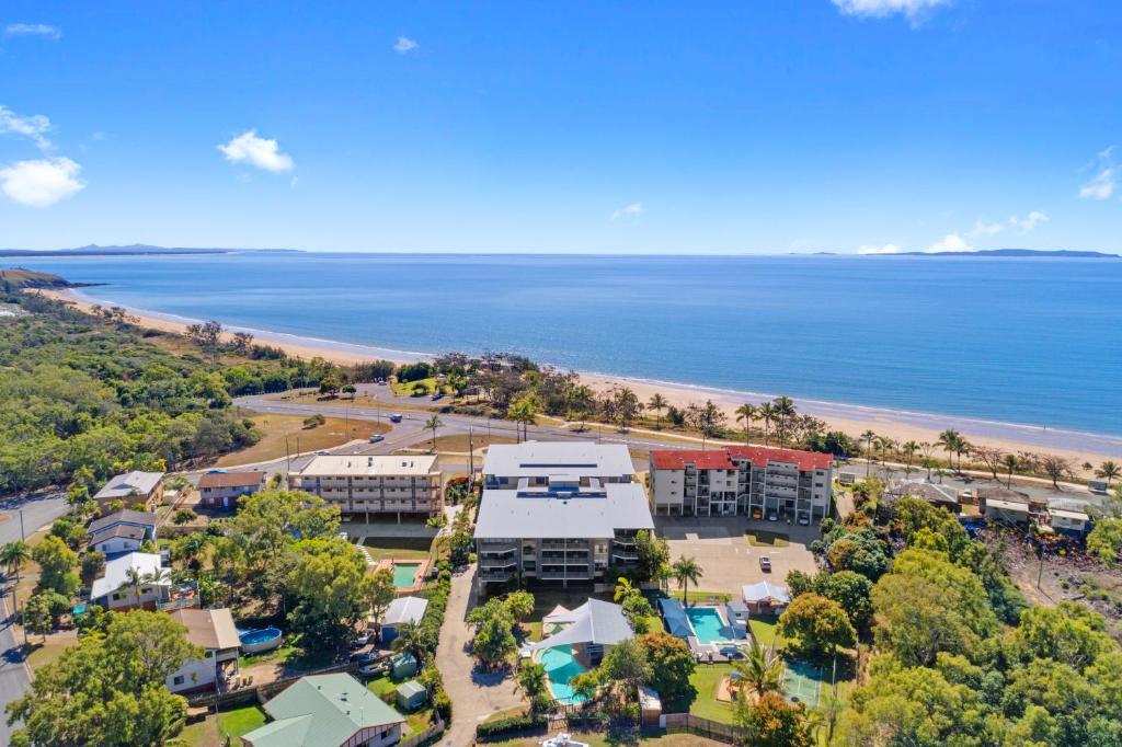 an aerial view of a resort and the beach at Beaches on Lammermoor Apartments in Yeppoon