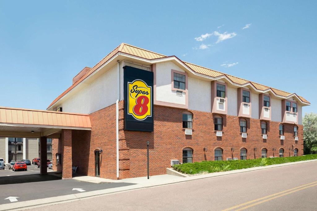 a building with a sign on the side of it at Super 8 by Wyndham Colorado Springs/Afa Area in Colorado Springs
