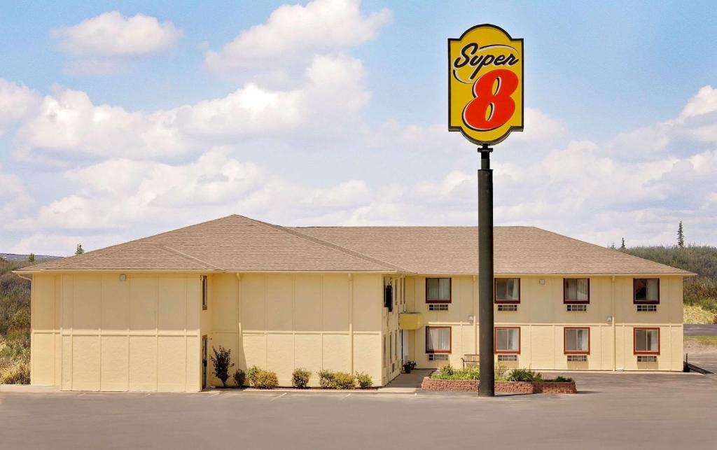 a sign for a super motel at Super 8 by Wyndham Rock Port MO in Rock Port