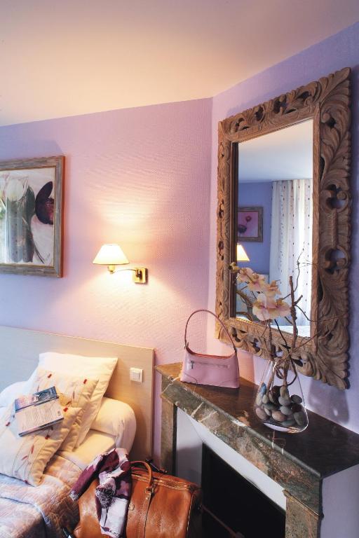 Postel nebo postele na pokoji v ubytování Hôtel Normandie Spa