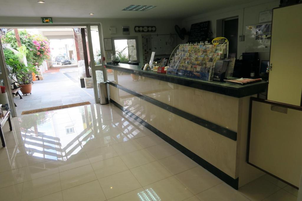 Kuchyň nebo kuchyňský kout v ubytování Central Hotel